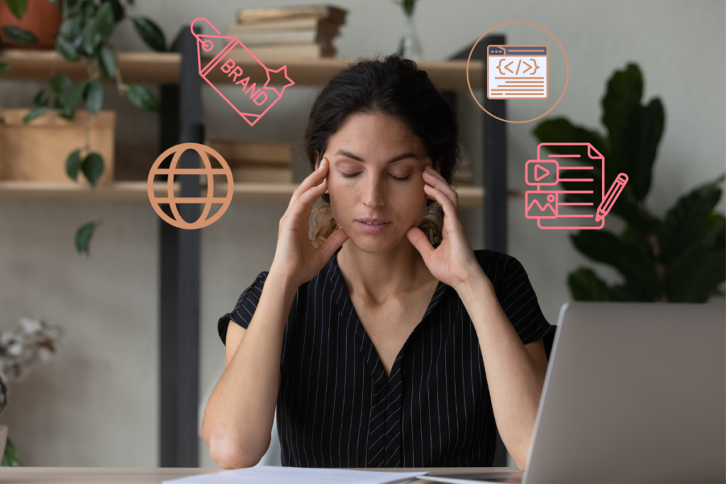 Woman working on laptop looking overwhelmed